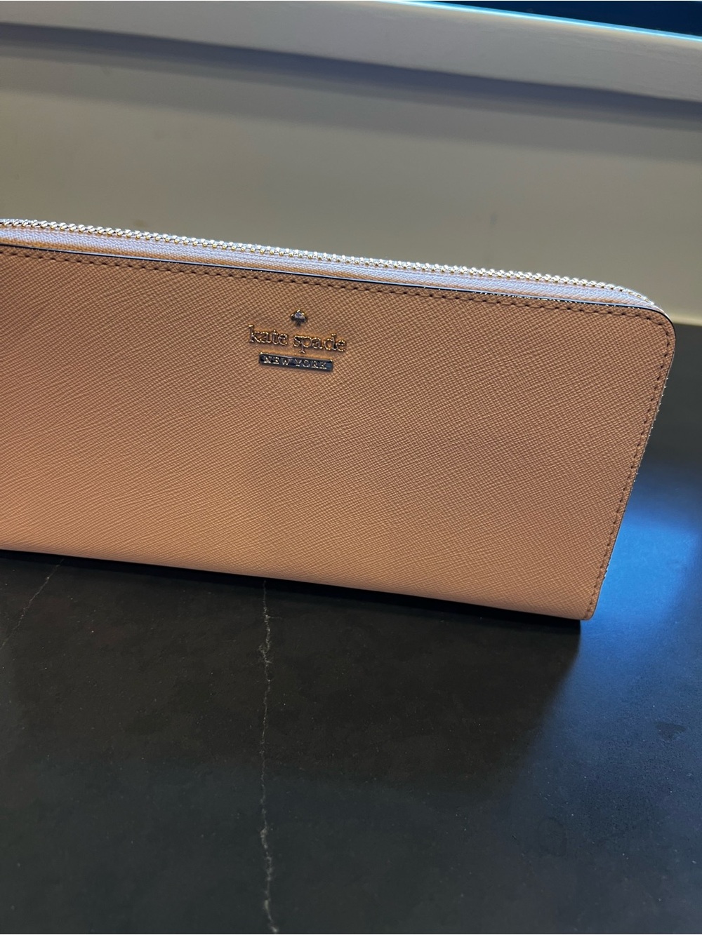 Kate Spade saffiano leather zip-around wallet in light pink with gold trim. NWT